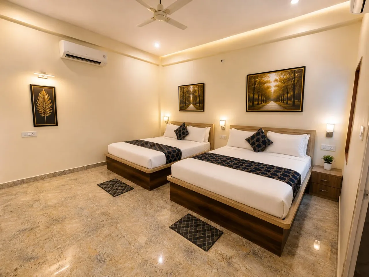 Spacious guest room featuring twin beds with upholstered headboards, split AC, ceiling fan, and golden botanical wall art